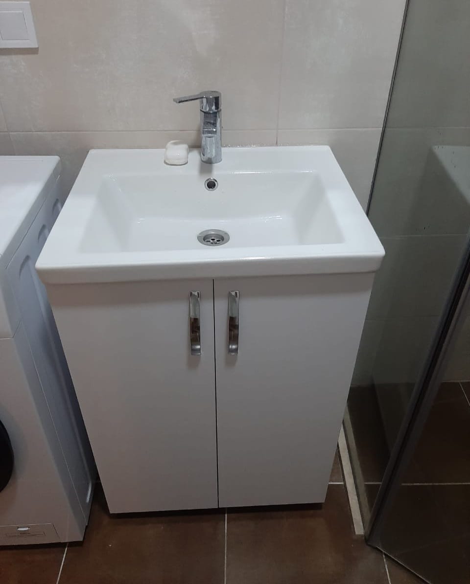 White Sails 6th floor apartment bathroom vanity unit white sink chrome tap